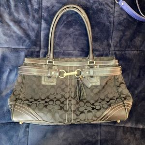 Black Coach Signature tote. gently used. Still in great condition.